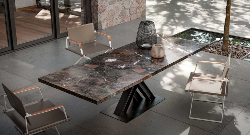 The Victor outdoor table by Draenert, handcrafted with natural stone and steel H-beams, designed by Wolfgang Mezger. Available at Home Resource of Sarasota, Florida.
 by DRAENERT for sale at Home Resource Modern Furniture Store Sarasota Florida