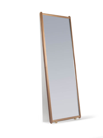 Luxurious Dorian mirror by Poltrona Frau with a padded leather frame, handmade stitching, and sleek modern design for a sophisticated bedroom. Available at Home Resource.
 by Poltrona Frau